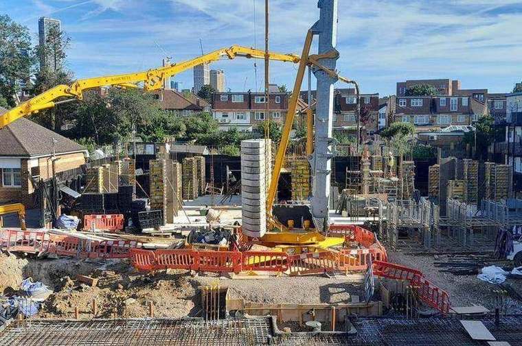 Concrete pump placing a slab pour