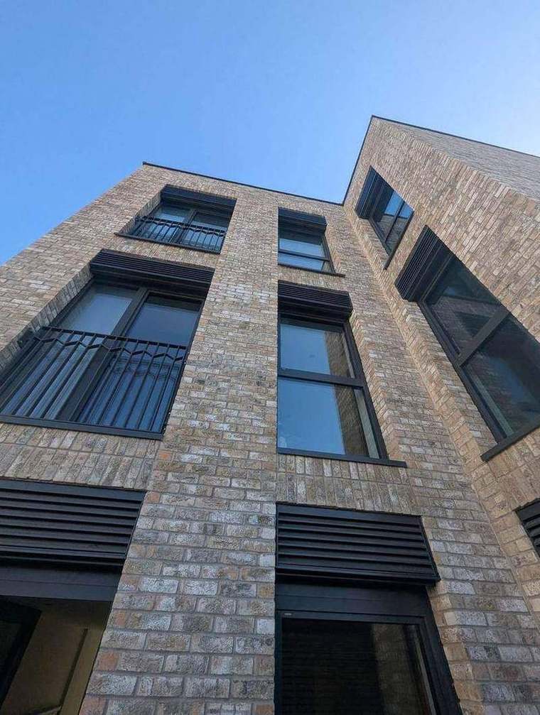 Completed brick elevation with metal balustrades