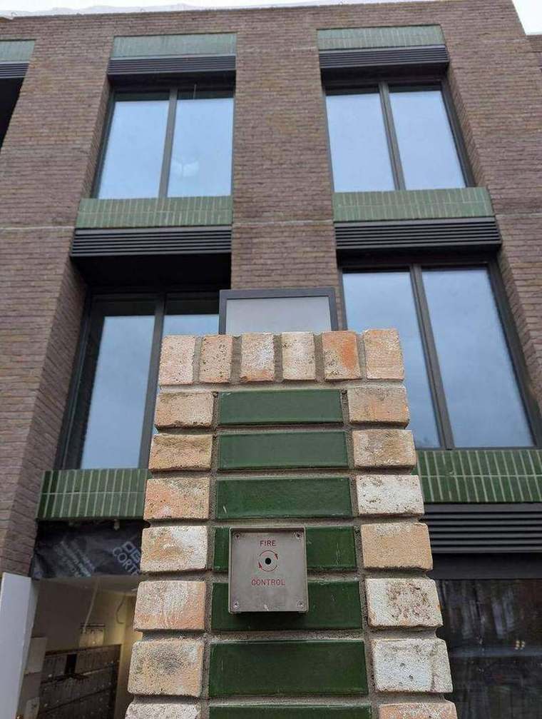 Brick sample panel approved before the envelope was built