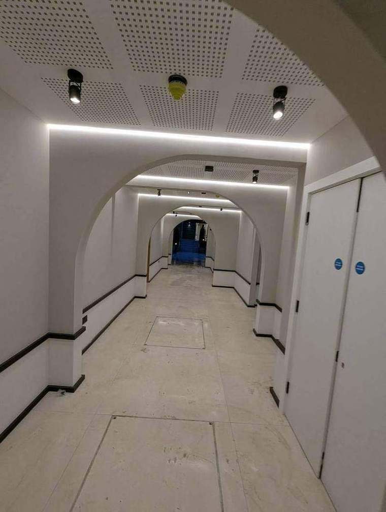 Communal corridor with arched ceiling detail