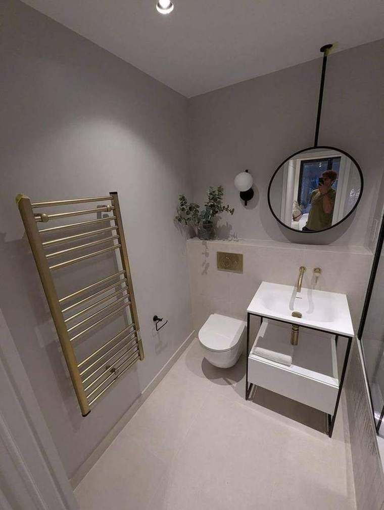 En-suite with heated towel rail and brass fittings