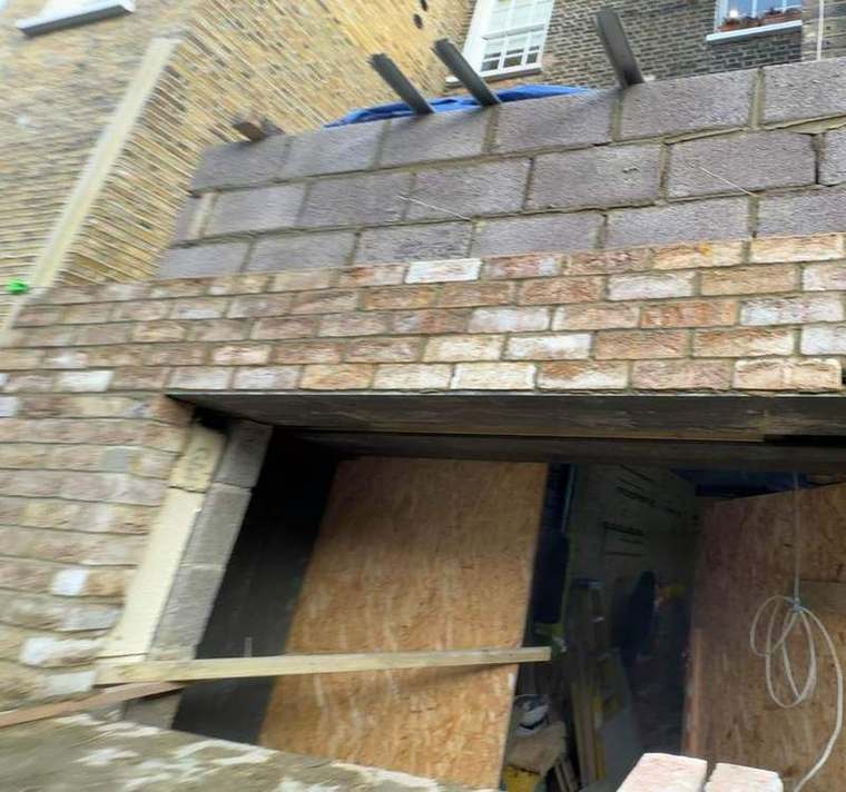Reclaimed brickwork laid over a new structural opening