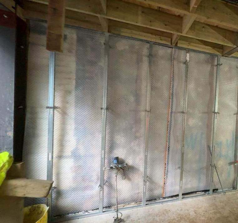Cavity drainage membrane on metal stud framing