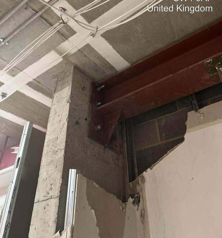 Beam end plate bolted to new blockwork bearing
