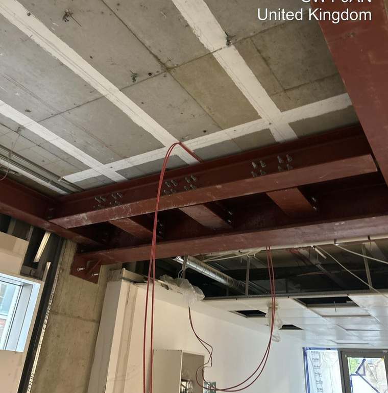 Completed steel grillage bolted up at ceiling level