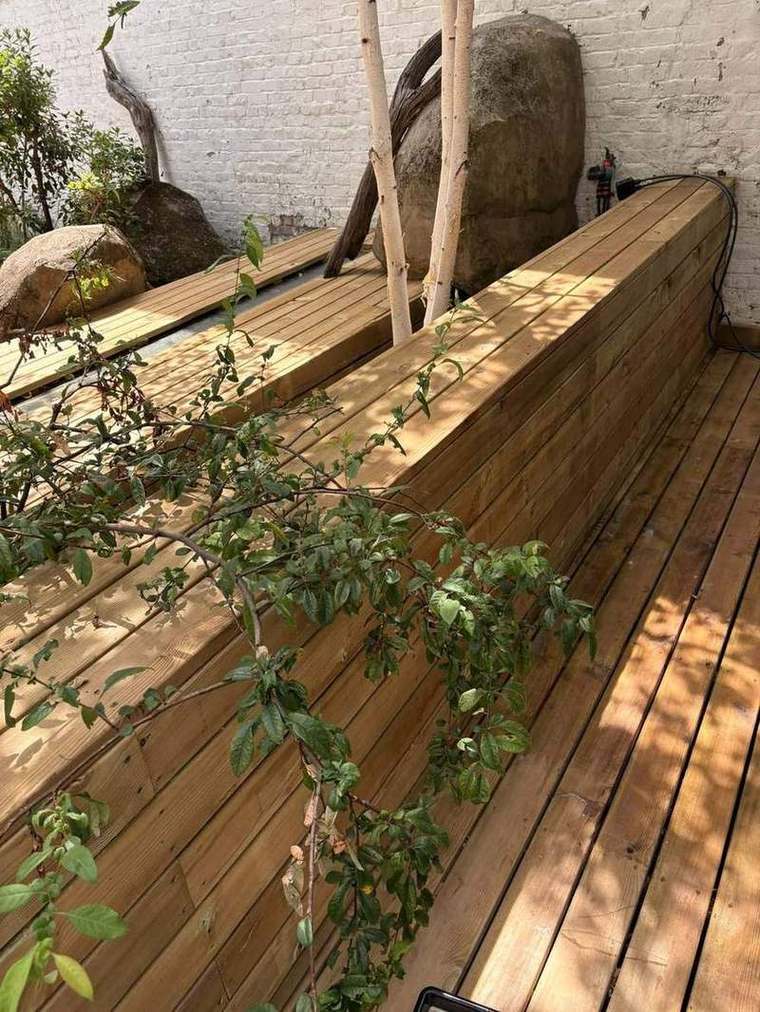 New decking meeting a built-in timber planter