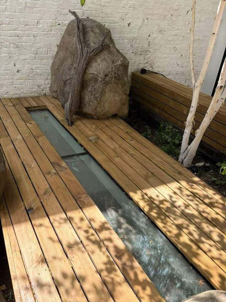 New timber decking laid either side of the walk-on glass strip