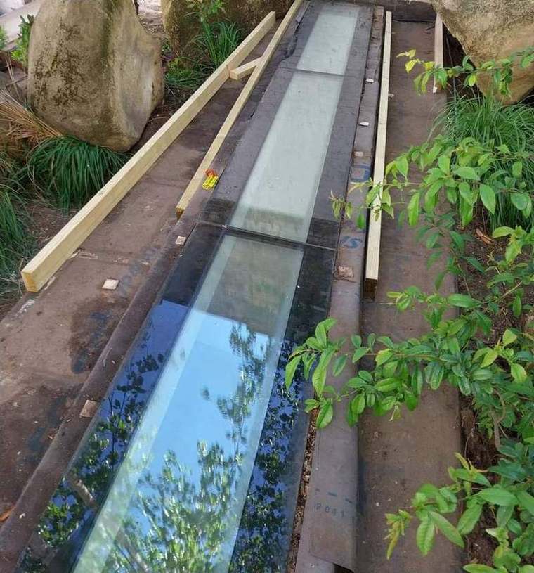Walk-on glass rooflight cleaned with new treated bearers set out
